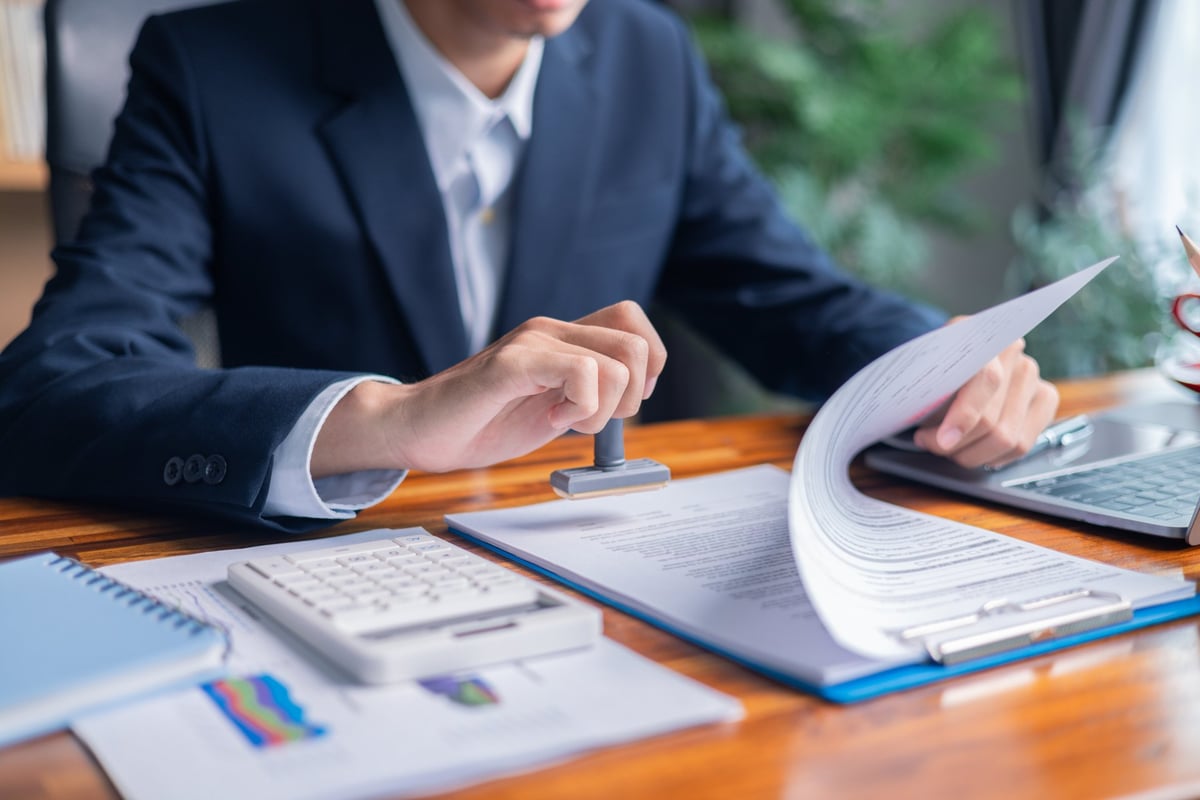 Advisor reviewing finance agreements and contract documents with a client