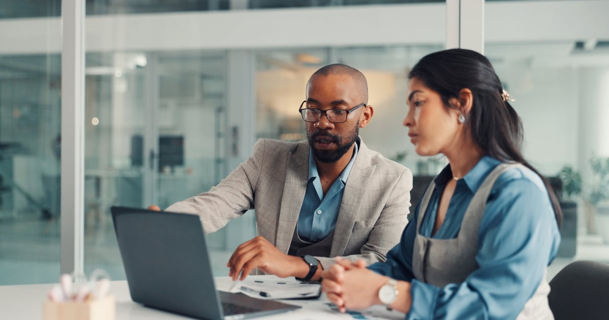 Financial advisors reviewing a budget and investment proposal together